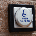 A disabled door access button with 'Push to Open' written on it