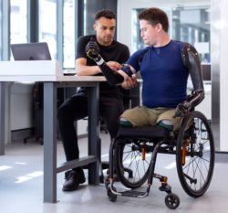 Man receiving bespoke disability robotics engineering