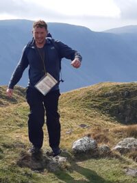 ISL resident Chris climbing mountain as part of his Yewbarrow challenge