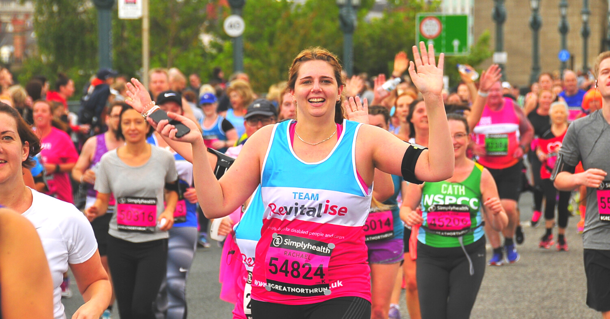A female runner running the Great North Run 2017 on the behalf of Revitalise