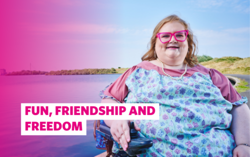 Image of our guest Abi Andrews posing for the camera in front of the Marine Lake. There's a pink overlay on the image with the text: Fun, friendship and freedom
